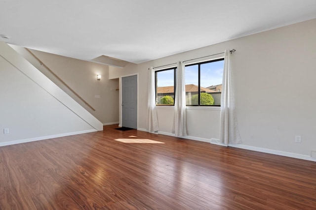 6548 N Bourbon St, Milwaukee, WI 53224 - unfurnished living room with wood finished floors and baseboards