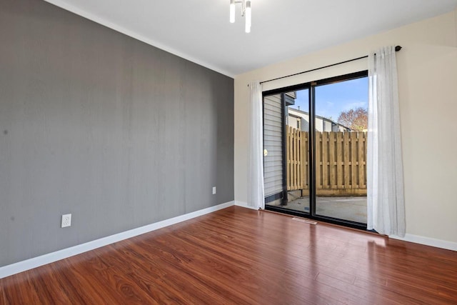 6548 N Bourbon St, Milwaukee, WI 53224 - empty room with wood finished floors and baseboards
