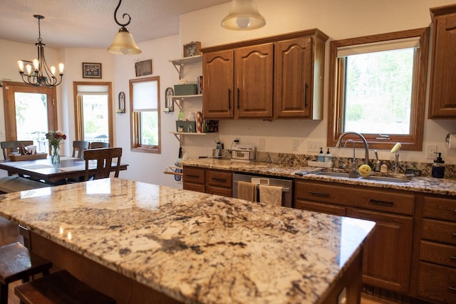 23718 Emblem Ave, Tomah, WI 54660 - kitchen featuring a sink, stainless steel dishwasher, light stone counters, open shelves, and a chandelier