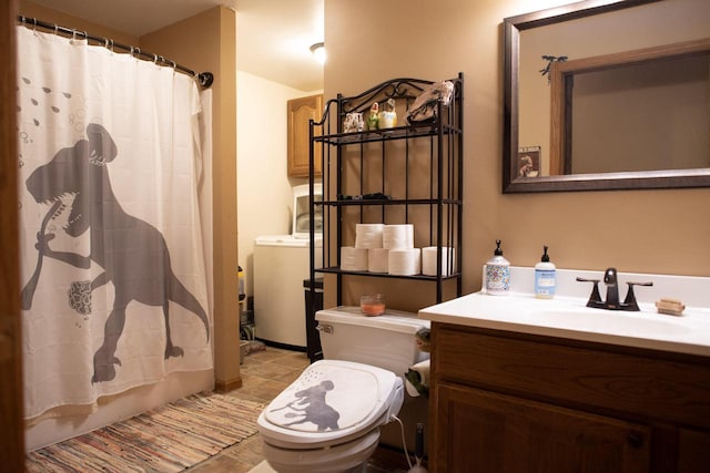 23718 Emblem Ave, Tomah, WI 54660 - full bathroom featuring toilet, washer / clothes dryer, vanity, and tile patterned floors