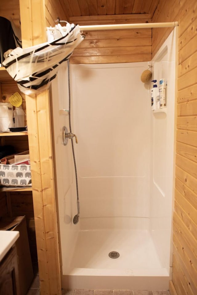 23718 Emblem Ave, Tomah, WI 54660 - full bath with a stall shower, wooden ceiling, and wooden walls