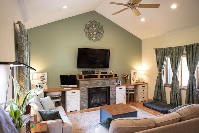 23718 Emblem Ave, Tomah, WI 54660 - living area with wood finished floors, recessed lighting, a ceiling fan, high vaulted ceiling, and a stone fireplace