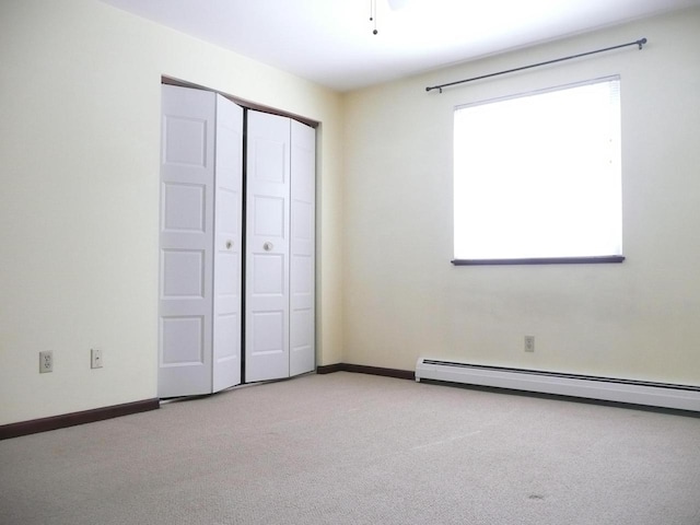2146 Allen Blvd Unit 3, Middleton, WI 54562 - unfurnished bedroom featuring carpet floors, baseboards, a baseboard heating unit, and a closet