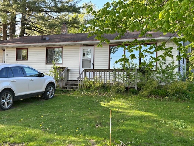 916 Fayette Ave, Rib Lake, WI 54470 - ranch-style house featuring a front yard and a chimney
