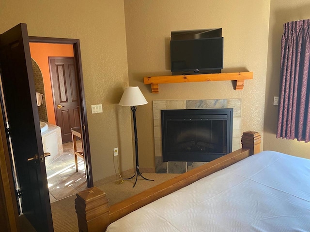2411 River Rd Unit 2443, Wisconsin Dells, WI 53965 - bedroom featuring a fireplace, a textured wall, and baseboards