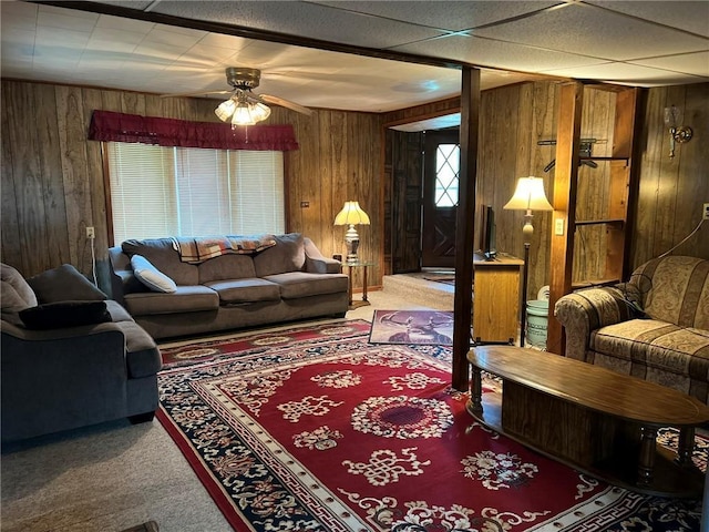 W4670 County Highway F, Springbrook, WI 54875 - living area featuring wood walls, carpet flooring, and ceiling fan