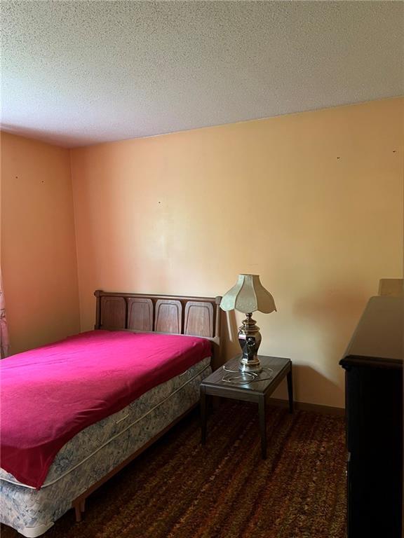 W4670 County Highway F, Springbrook, WI 54875 - bedroom with a textured ceiling