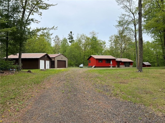 W4670 County Highway F, Springbrook, WI 54875 - view of green lawn featuring an outdoor structure and a detached garage