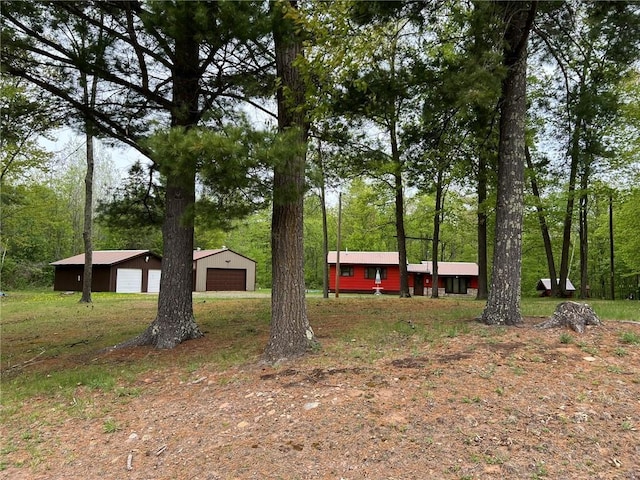 W4670 County Highway F, Springbrook, WI 54875 - view of yard featuring a garage and an outbuilding