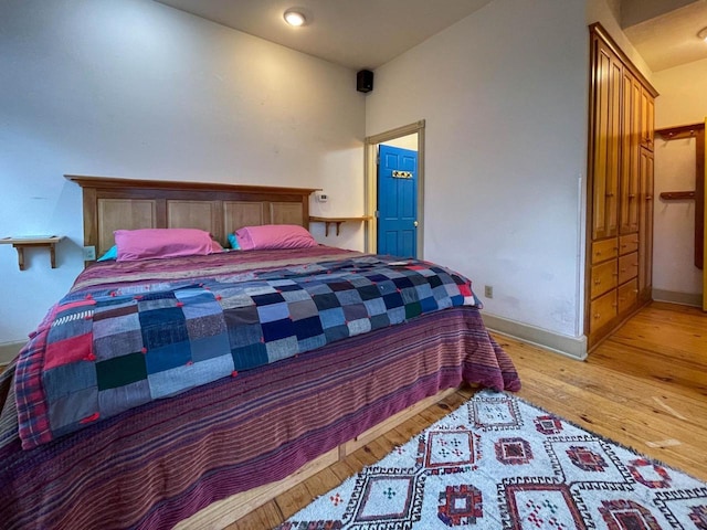 8395 Woolpy Dr, Minocqua, WI 54548 - bedroom featuring wood finished floors and baseboards