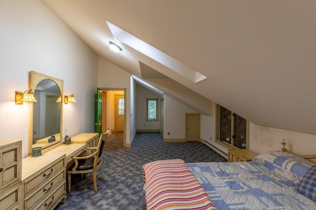 8395 Woolpy Dr, Minocqua, WI 54548 - bedroom with vaulted ceiling, a skylight, a baseboard radiator, dark carpet, and a desk