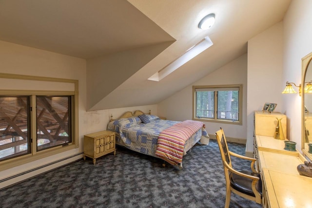 8395 Woolpy Dr, Minocqua, WI 54548 - carpeted bedroom featuring lofted ceiling, a skylight, and baseboard heating