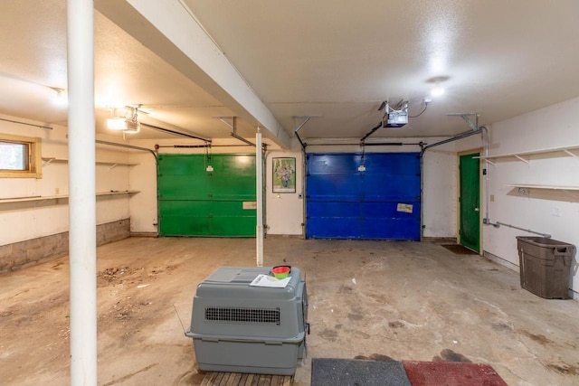 8395 Woolpy Dr, Minocqua, WI 54548 - garage featuring a garage door opener