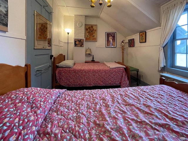 8395 Woolpy Dr, Minocqua, WI 54548 - carpeted bedroom with multiple windows and lofted ceiling