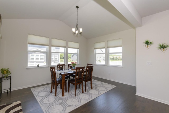 W242N5663 Simona Dr, Sussex, WI 53089 - dining area featuring lofted ceiling, a chandelier, hardwood / wood-style flooring, and baseboards