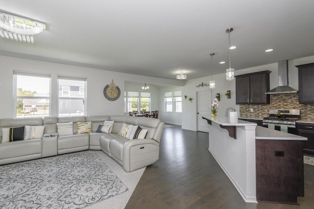 W242N5663 Simona Dr, Sussex, WI 53089 - living room featuring dark wood-type flooring and recessed lighting