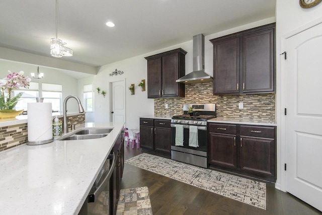 W242N5663 Simona Dr, Sussex, WI 53089 - kitchen with stainless steel gas range oven, wall chimney exhaust hood, a sink, tasteful backsplash, and dark wood-style flooring