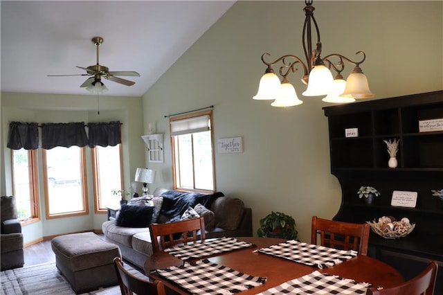 3530 Briarcrest Dr, Eau Claire, WI 54701 - dining room with a chandelier, vaulted ceiling, ceiling fan, and wood finished floors