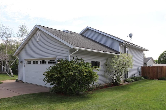 3530 Briarcrest Dr, Eau Claire, WI 54701 - view of side of property featuring concrete driveway, a garage, and a shingled roof