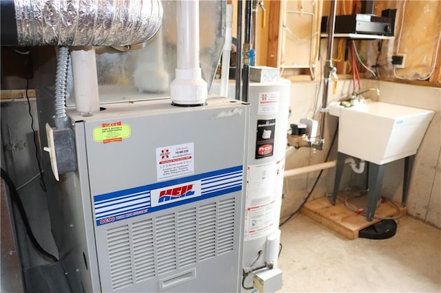3530 Briarcrest Dr, Eau Claire, WI 54701 - utility room featuring heating unit and a sink
