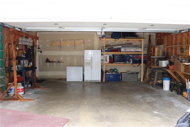 3530 Briarcrest Dr, Eau Claire, WI 54701 - garage with white refrigerator with ice dispenser and refrigerator