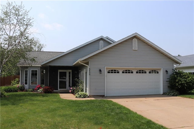 3530 Briarcrest Dr, Eau Claire, WI 54701 - ranch-style home featuring a garage, concrete driveway, and a front lawn