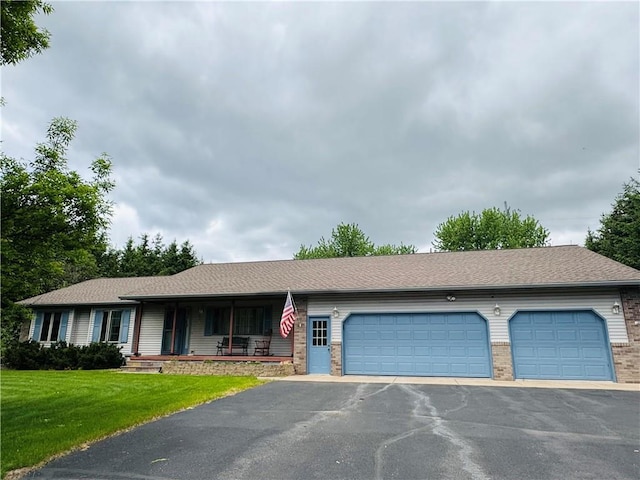 18886 53rd Ave, Chippewa Falls, WI 54729 - ranch-style home featuring driveway, a porch, brick siding, an attached garage, and a front yard