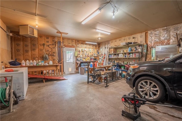 18886 53rd Ave, Chippewa Falls, WI 54729 - garage featuring a workshop area and a porch