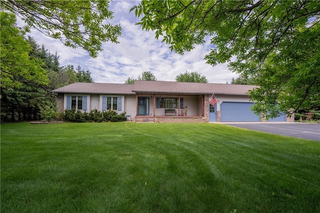 18886 53rd Ave, Chippewa Falls, WI 54729 - single story home with asphalt driveway, an attached garage, a front yard, and a porch