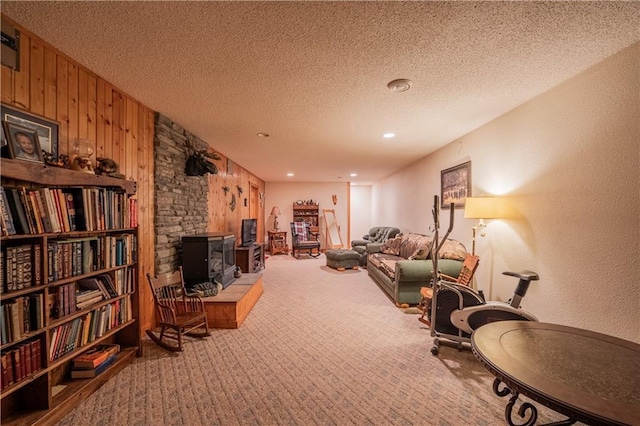 18886 53rd Ave, Chippewa Falls, WI 54729 - living room featuring carpet flooring, wooden walls, and a textured ceiling