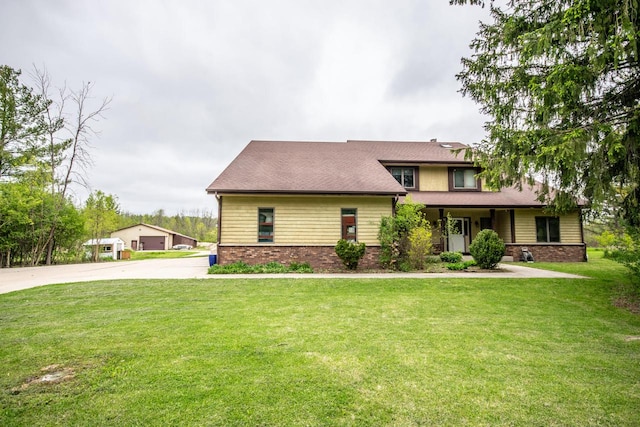 N124W13900 Lovers Ln, Germantown, WI 53022 - view of front of home with a front lawn, brick siding, and a garage