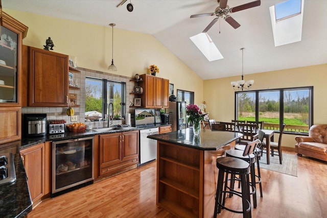 N124W13900 Lovers Ln, Germantown, WI 53022 - kitchen with open shelves, wine cooler, a sink, dishwasher, and high vaulted ceiling