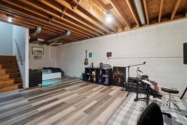 N124W13900 Lovers Ln, Germantown, WI 53022 - basement with wood finished floors, concrete block wall, and stairs