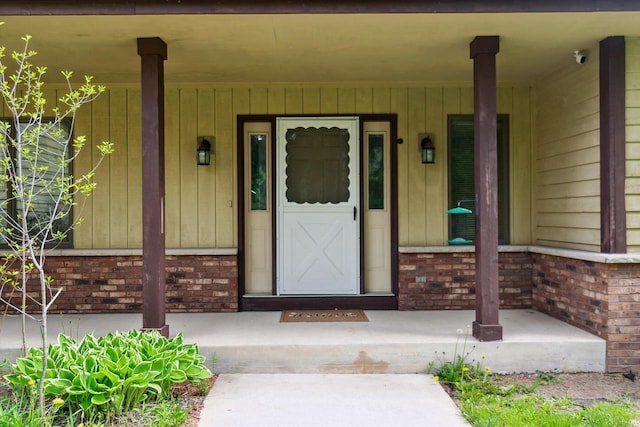 N124W13900 Lovers Ln, Germantown, WI 53022 - entrance to property featuring covered porch and brick siding