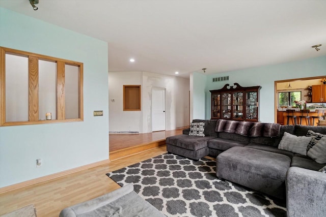 N124W13900 Lovers Ln, Germantown, WI 53022 - living area featuring wood finished floors and recessed lighting