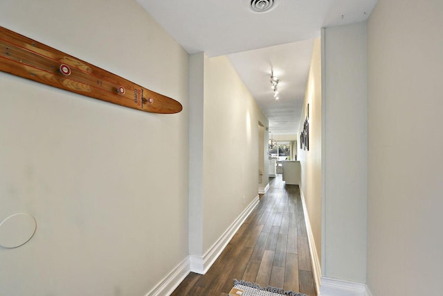 W5229 Surfwood Dr Unit 3B, Elkhorn, WI 53121 - corridor featuring dark wood finished floors and baseboards