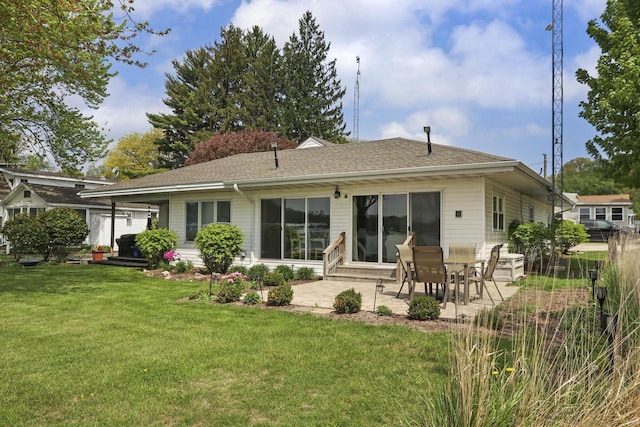 W5229 Surfwood Dr Unit 3B, Elkhorn, WI 53121 - back of property featuring a patio area, a lawn, and a shingled roof