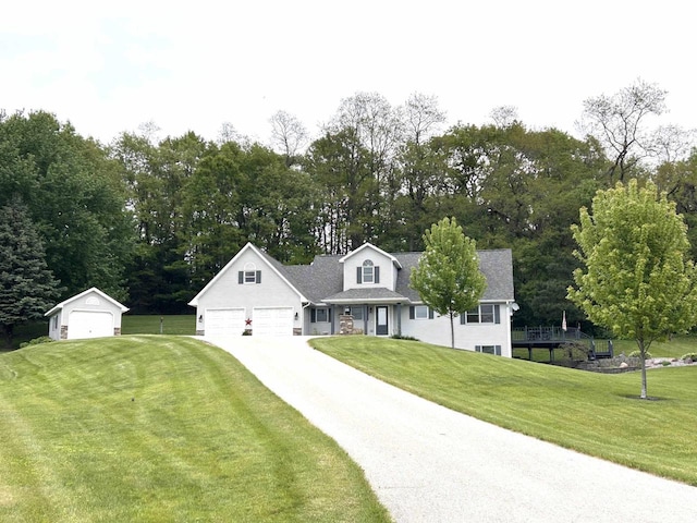 12541 Fleetwood Rd, Tomah, WI 54660 - view of front facade with a front lawn, view of scattered trees, and driveway