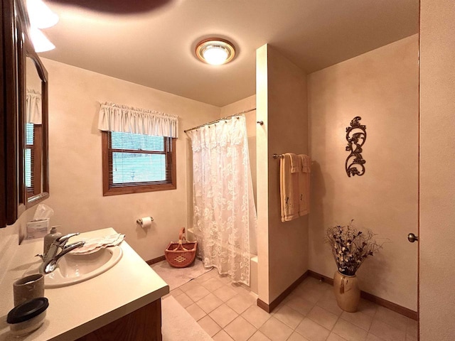 12541 Fleetwood Rd, Tomah, WI 54660 - bathroom with tile patterned floors, vanity, baseboards, and shower / bath combo