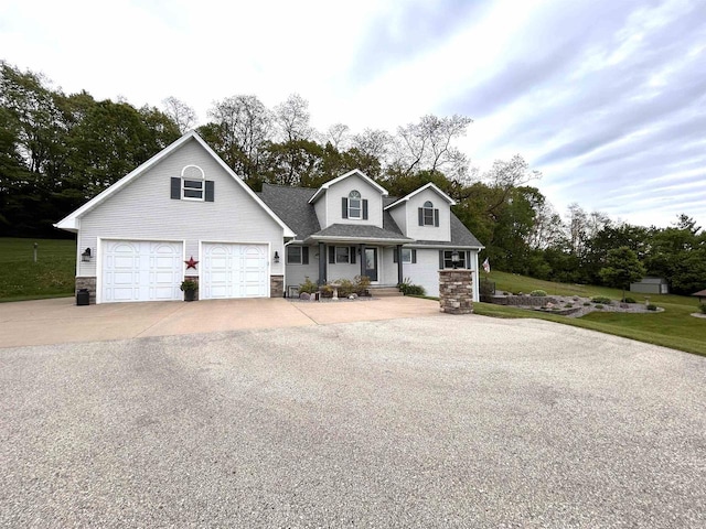 12541 Fleetwood Rd, Tomah, WI 54660 - view of front of home with stone siding, concrete driveway, and a shingled roof