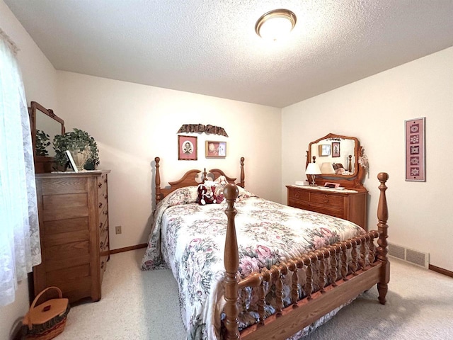 12541 Fleetwood Rd, Tomah, WI 54660 - bedroom with light colored carpet, baseboards, and a textured ceiling