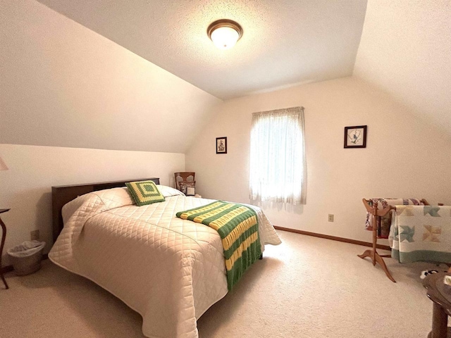 12541 Fleetwood Rd, Tomah, WI 54660 - carpeted bedroom with lofted ceiling, baseboards, and a textured ceiling