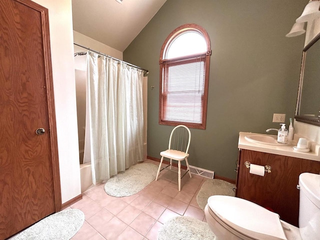 12541 Fleetwood Rd, Tomah, WI 54660 - full bath with toilet, tile patterned flooring, vaulted ceiling, vanity, and baseboards