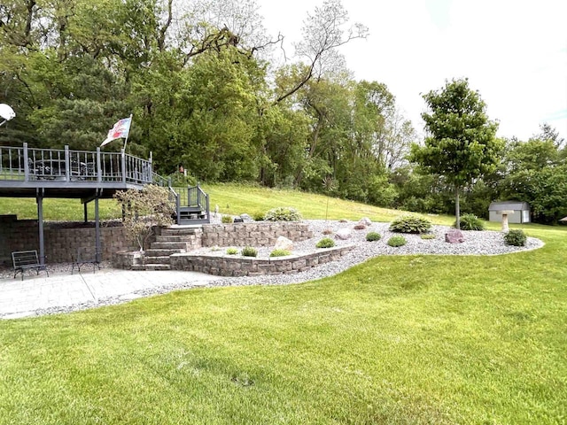 12541 Fleetwood Rd, Tomah, WI 54660 - view of grassy yard with stairs, a wooden deck, and a patio area