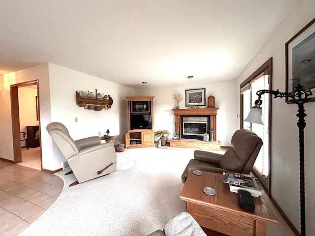 12541 Fleetwood Rd, Tomah, WI 54660 - tiled living area with a glass covered fireplace and baseboards