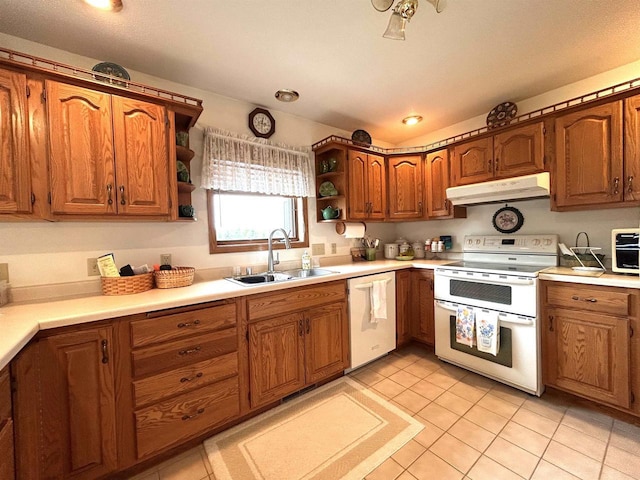 12541 Fleetwood Rd, Tomah, WI 54660 - kitchen featuring white appliances, under cabinet range hood, a sink, open shelves, and brown cabinetry