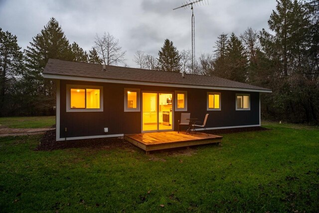 N3725 County Road Ee, Redgranite, WI 54970 - back of property featuring a deck and a lawn