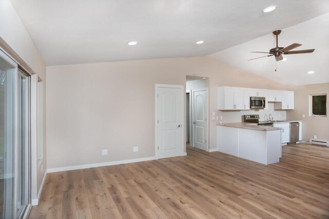 N3725 County Road Ee, Redgranite, WI 54970 - kitchen featuring appliances with stainless steel finishes, lofted ceiling, white cabinetry, light wood-type flooring, and ceiling fan