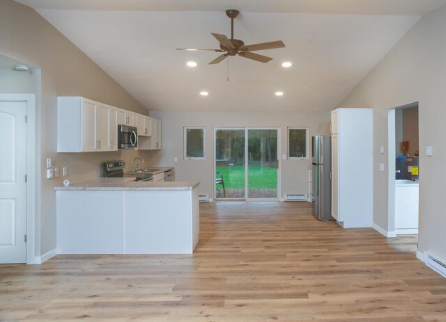 N3725 County Road Ee, Redgranite, WI 54970 - kitchen featuring appliances with stainless steel finishes, lofted ceiling, a ceiling fan, light countertops, and light wood-style floors