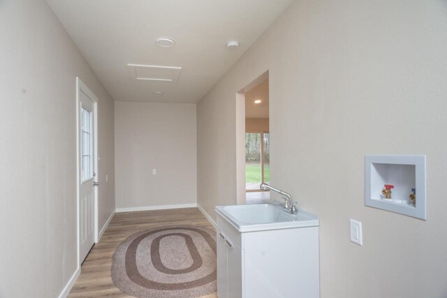 N3725 County Road Ee, Redgranite, WI 54970 - laundry room with washer hookup, light wood-style floors, attic access, and baseboards